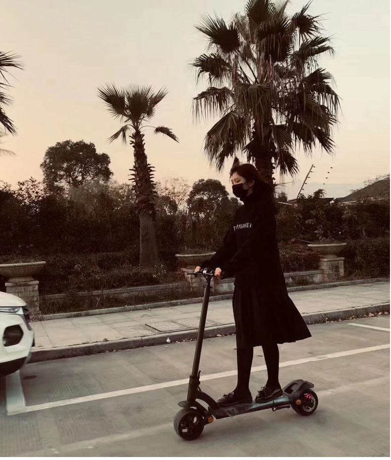 Double Drive Folding Electric Scooter with Wide 10-Inch Solid Tires, Max Speed 40km/h, Mobile App Connectivity, and Compact Foldable Design for Ultimate Convenience and Performance"